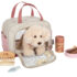 Chien avec sac et kit de soins rose